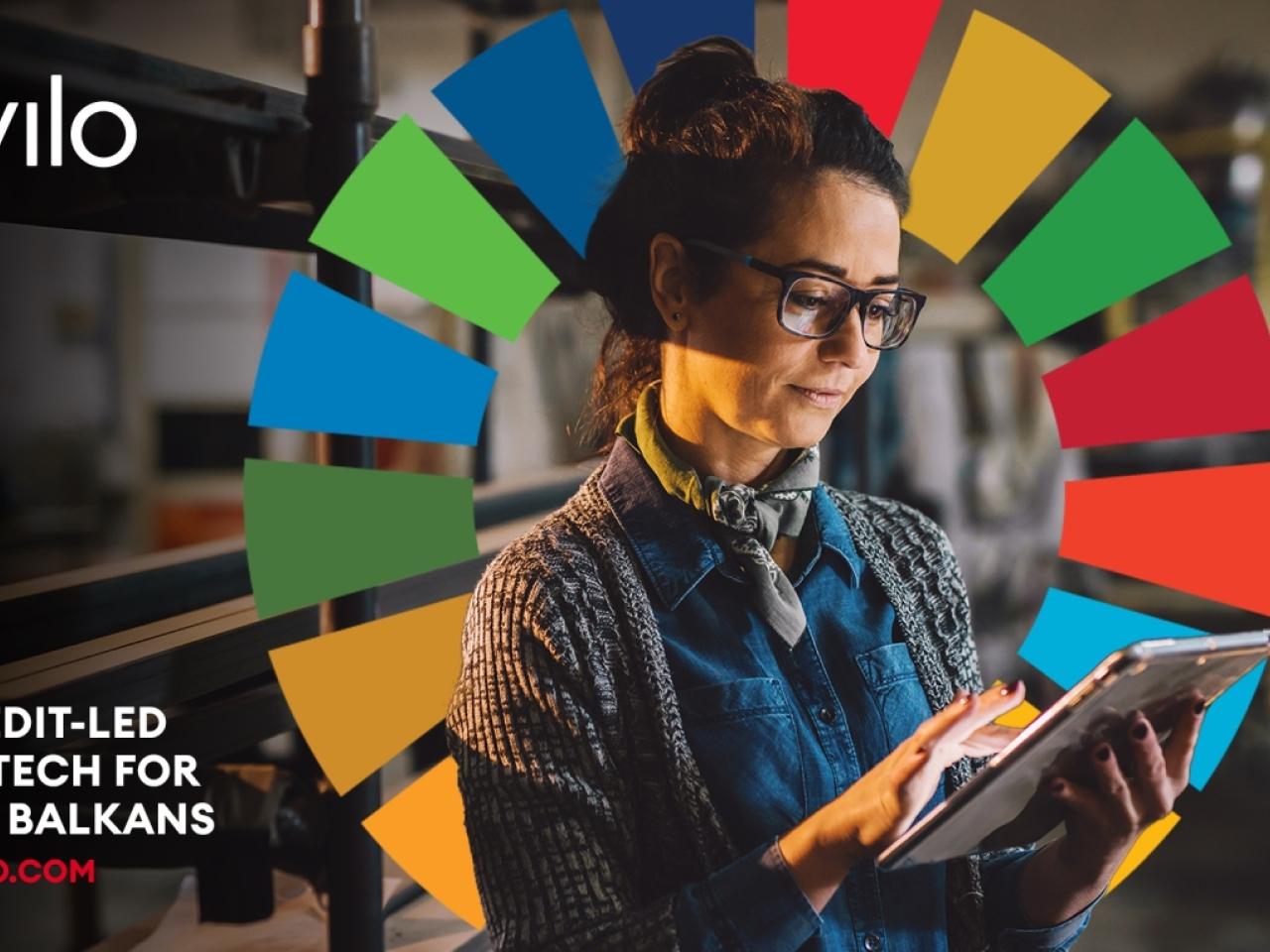 Person using tablet with SDGs logo in background