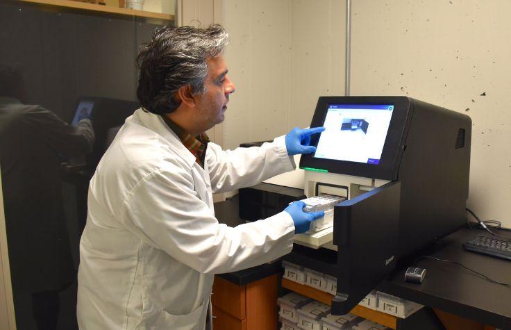 Dr. Mehrdad Hajibabaei works with the Illumina MiSeq System in his lab at the Centre for Biodiversity Genomics, University of Guelph. | Photo: Courtesy of University of Guelph