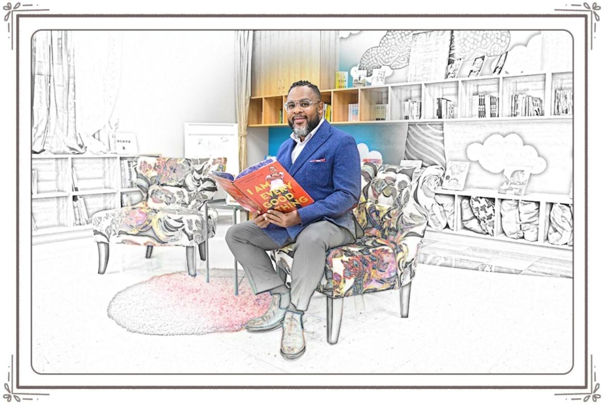 Julius sitting in a chair in a library setting, reading a book. The background goes from black and white, like a coloring page, to full color around him.