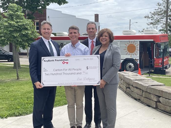  KeyBank Regional Sales Executive Tim Burke (second from right) along with KeyBank East Ohio Market President Eric Dellapina (far left) and KeyBank Regional Retail Leader Becky Talley (far right) present Executive Director of Canton for All People Don Ackerman (second from left) with $200,000 grant.