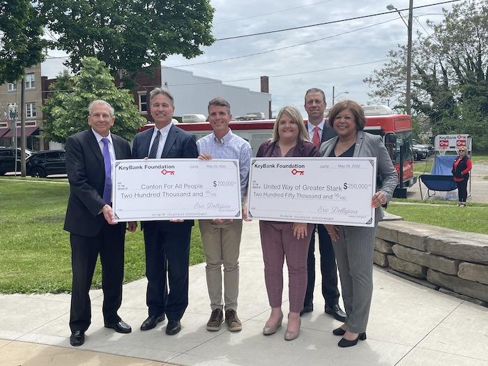 KeyBank Regional Sales Executive Tim Burke (second from right) along with KeyBank East Ohio Market President Eric Dellapina (far left) KeyBank Regional Retail Leader Becky Talley (far right) and Canton City Mayor Thomas Bernabei (far left) present Executive Director of Canton for All People Don Ackerman (third from left) with $200,000 grant and President and CEO of United Way Angela Perisic (third from right) with $250,000 grant.   