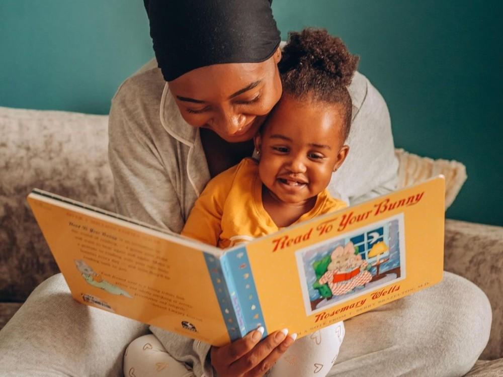 mother reading to daughter 