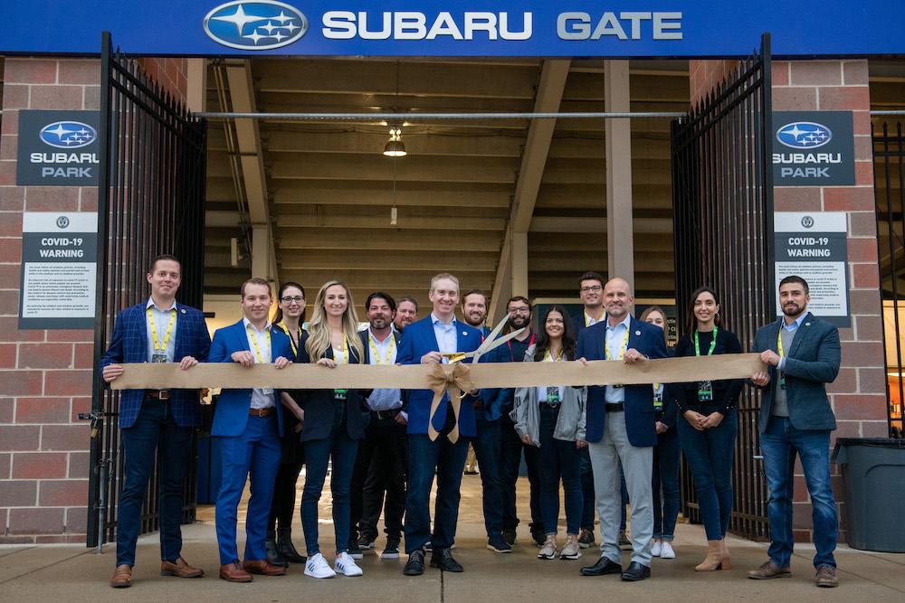 Alan Bethke (center), Senior Vice President - Marketing, Subaru of America Inc. is joined by Philadelphia Union executives and staff at ceremonial ribbon cutting to re-open Subaru Park as zero landfill on October 23, 2021.