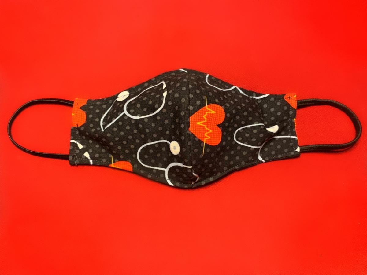 a protective fabric mask against a red background