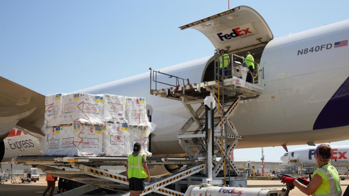 Medical supplies being loaded into a FedEx plane