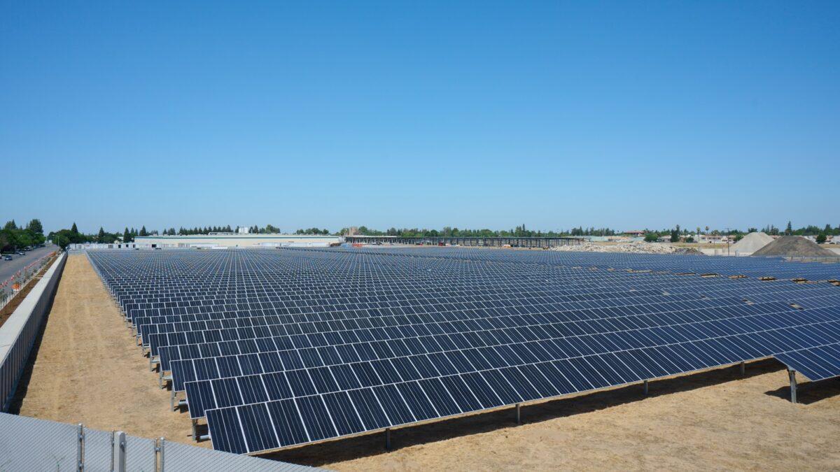 Panoramic view of a large solar panel covered field