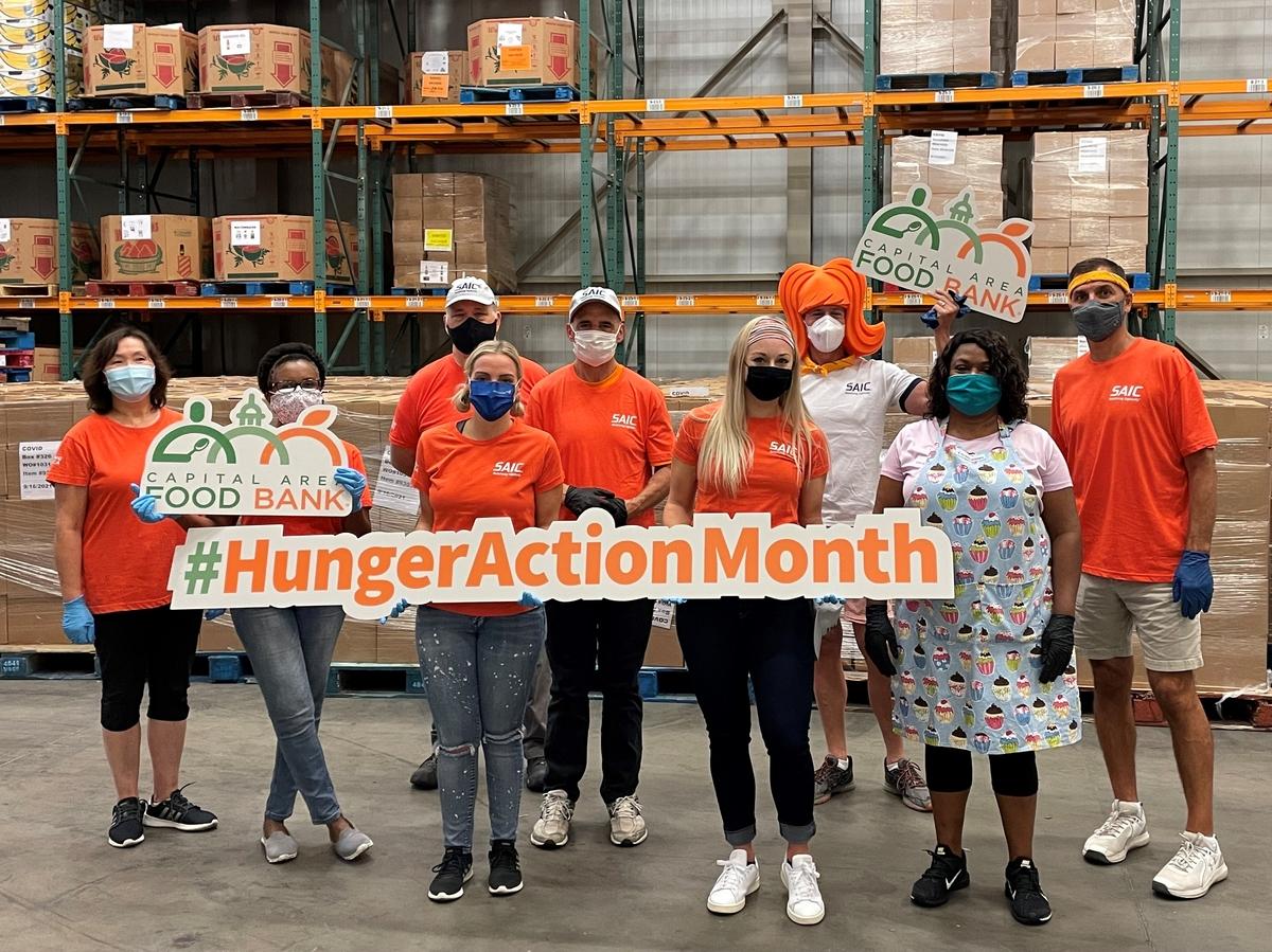 Equality Alliance members help out at a local food bank during Feeding America's Hunger Action Month.