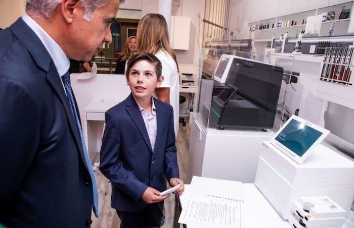 BizTown pictured in front of an Illumina sequencer.