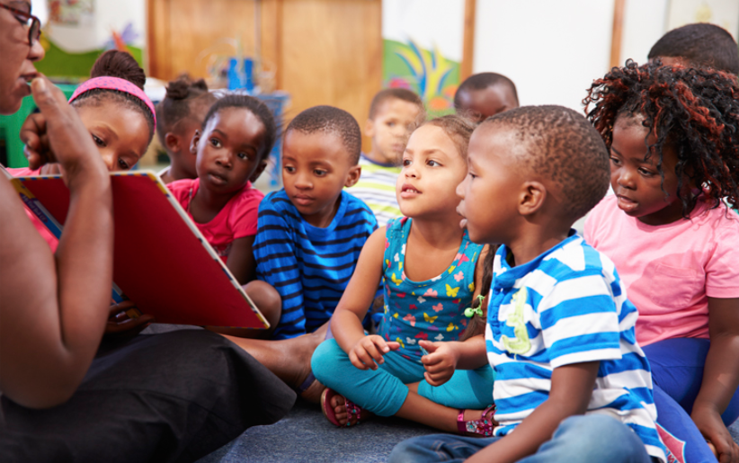 young children sitting together for story time
