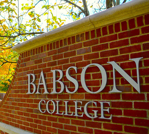 a brick exterior wall with "Babson College" lettering on it