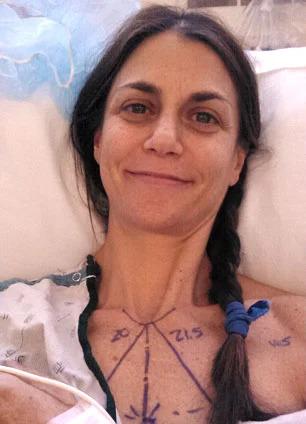 Samantha Harris in a hospital bed, markings on her chest
