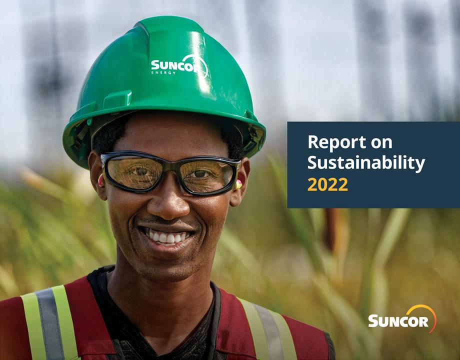 Suncor report on Sustainability 2022 with smiling person wearing a hardhat