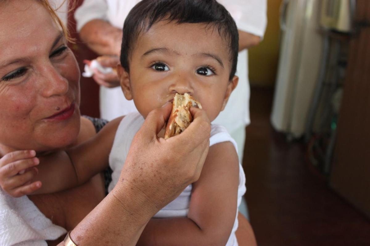 woman feeding baby food